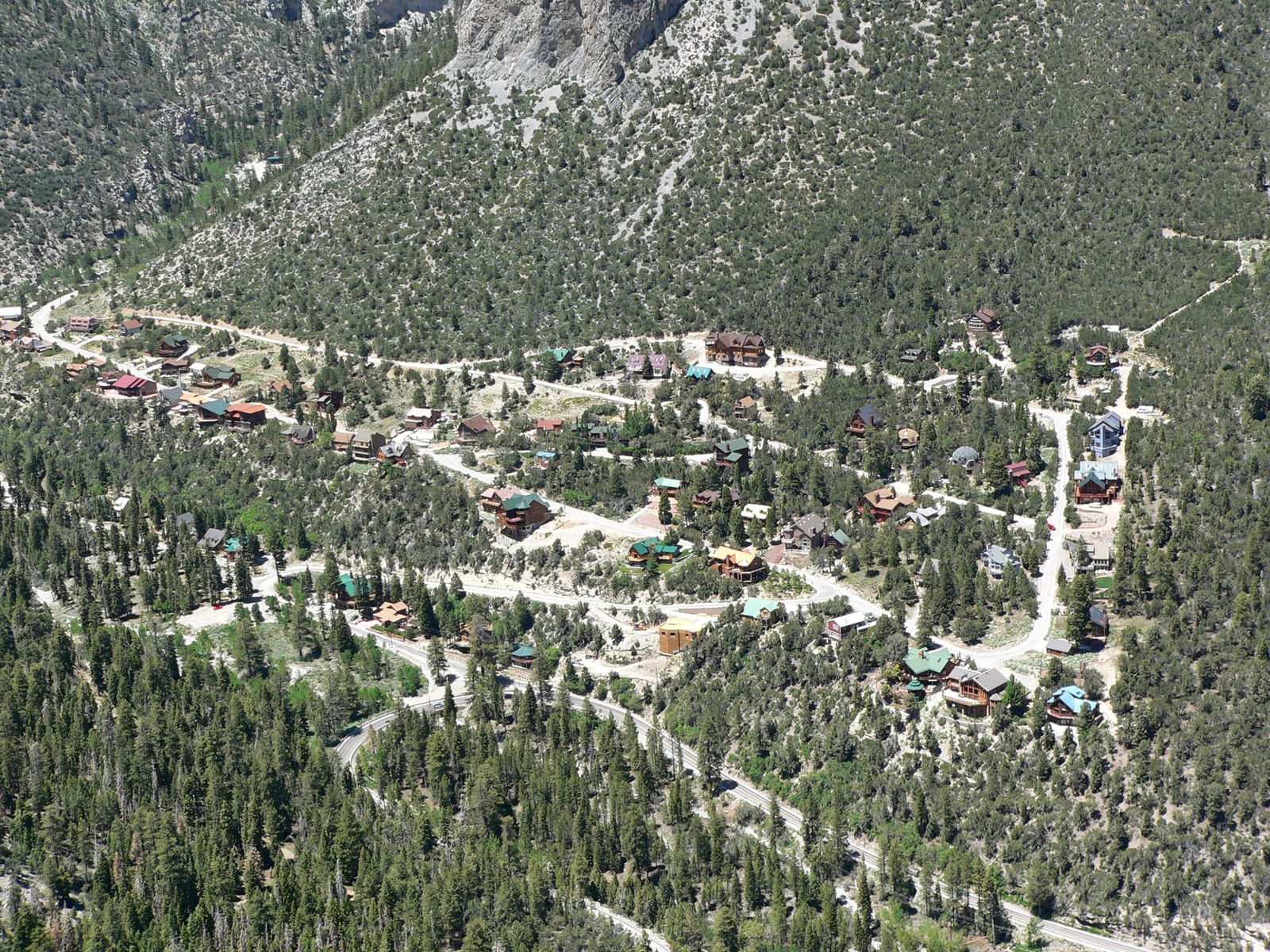 Pine-forested slopes and cabins below the peak of Mount Charleston in the Spring Mountains near Las Vegas